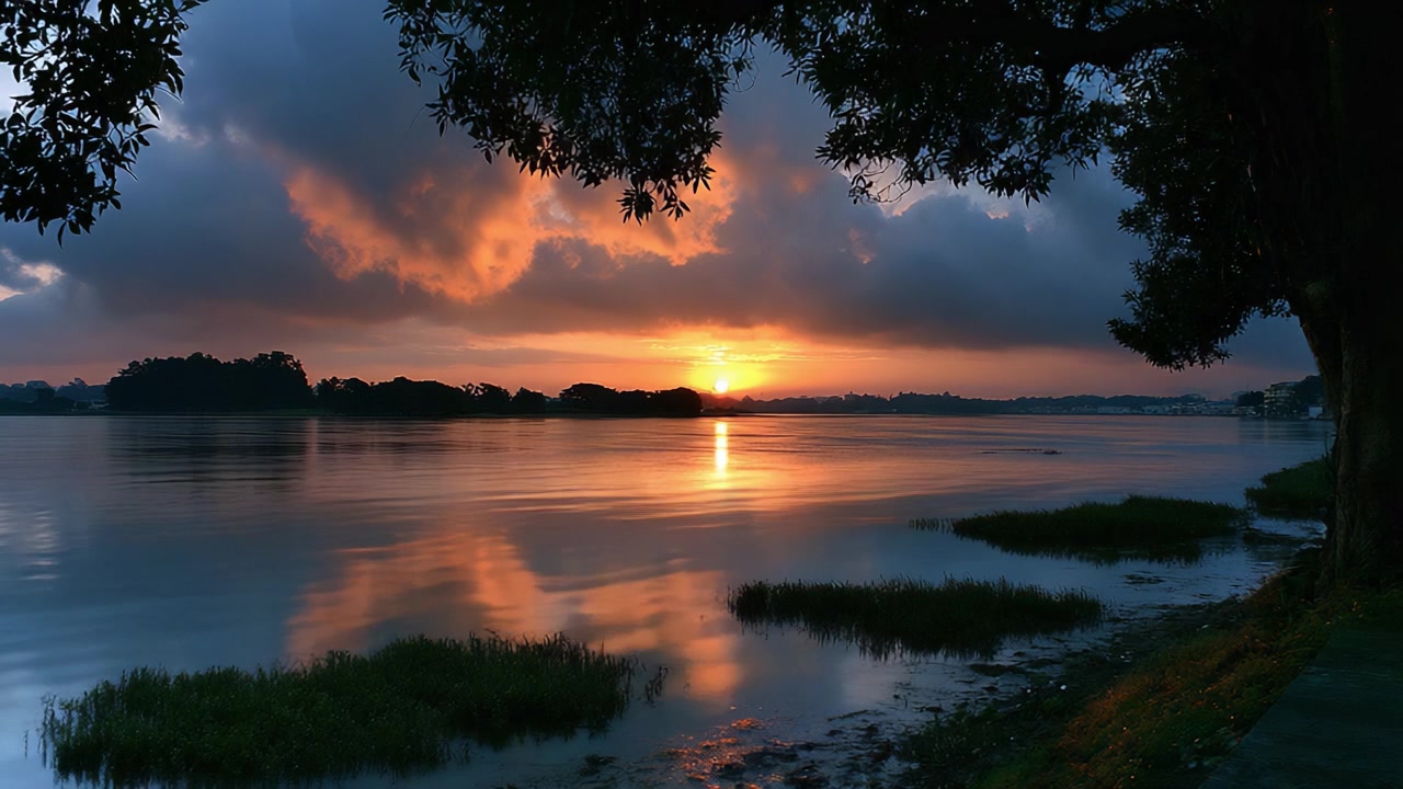 A Tranquil Sunset Over the Water: Nature's Serene Beauty Captured in Two Frames Showing the Transition from Day to Night
