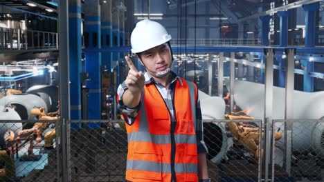 factory worker giving stop signal