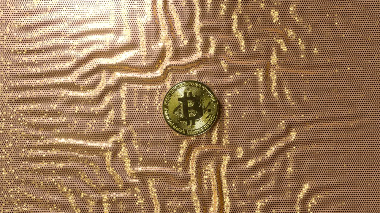 bitcoin en tela de oro