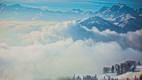time lapse: snow covered mountains with billowy clouds, view from italy wales sky resort