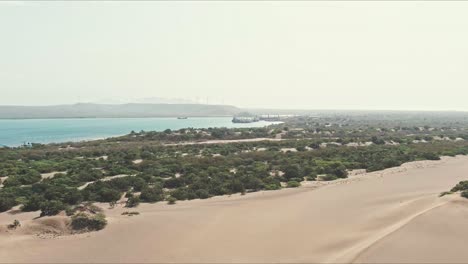 Aerial-view-over-the-Dunes-of-Bani-in-Dominican-Republic---reverse,-drone-shot