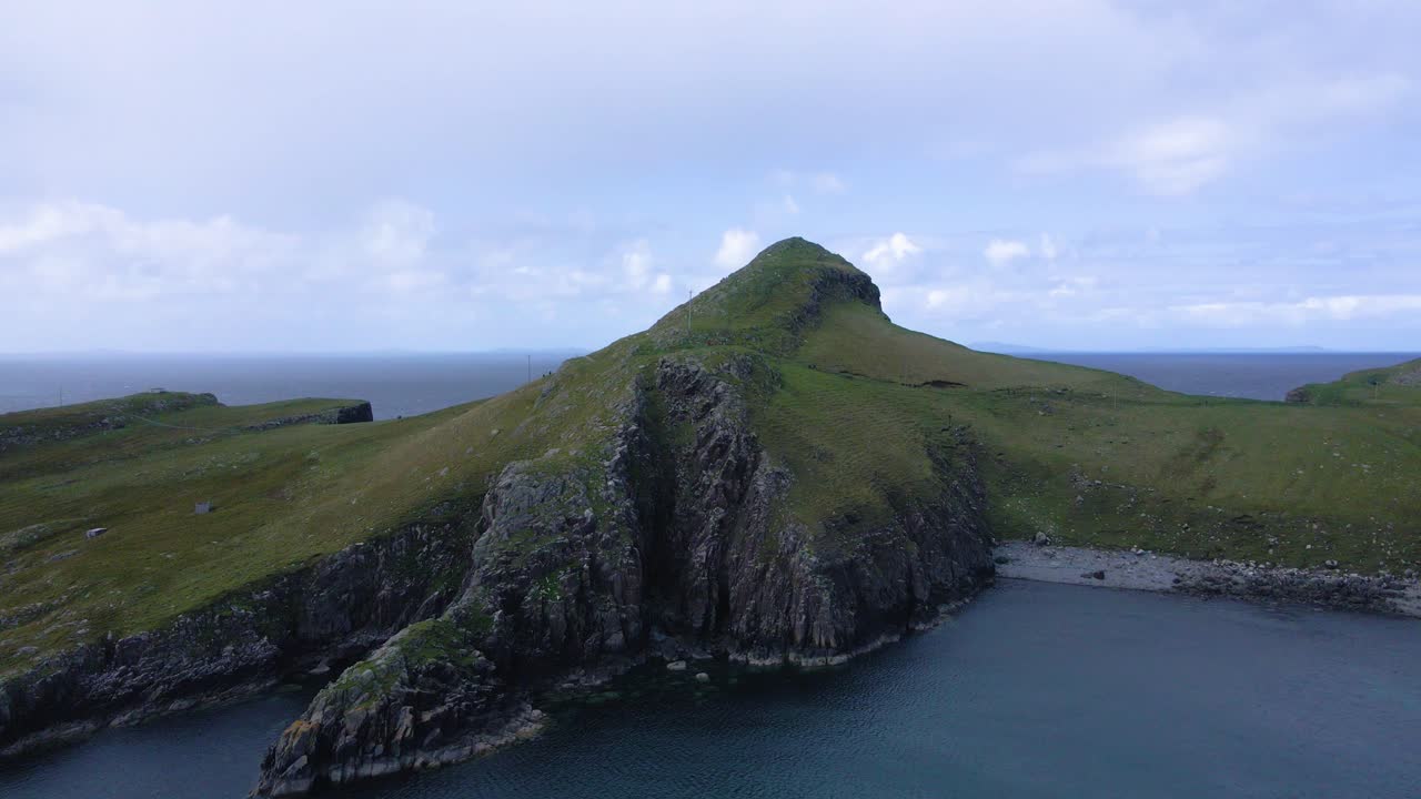 Drone shot flying towards Neist Point on the Isle of Skye in the Scottish highlands.