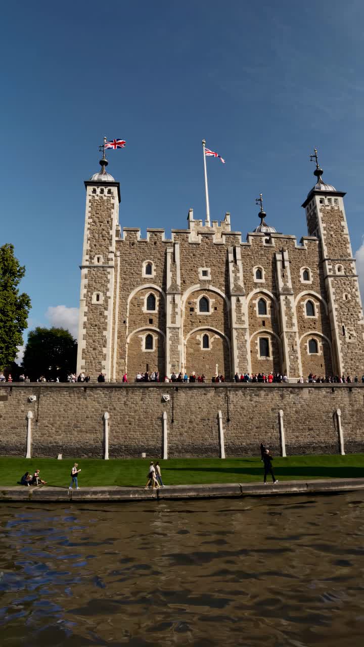 Video captures a historic castle from a low angle, emphasizing its grandeur against a clear sky
