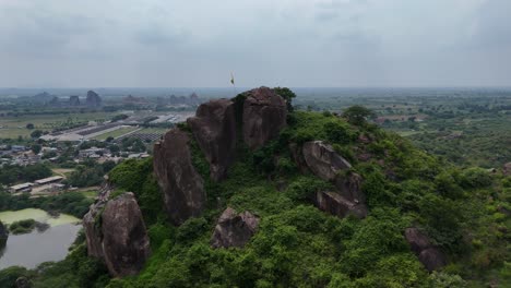 vijayawada city captured from above, where the urban skyline meets the scenic and serene hills.