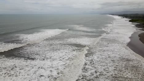 Aerial-view-of-the-Kerambitan-coastline-in-Tabanan,-Bali,-Indonesia,-captured-on-a-cloudy-day