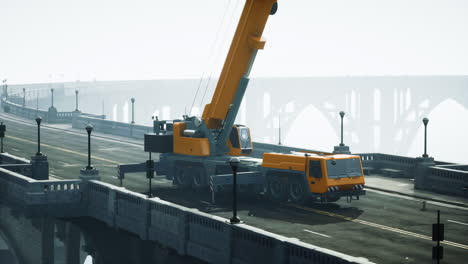 construction crane on a bridge in foggy conditions