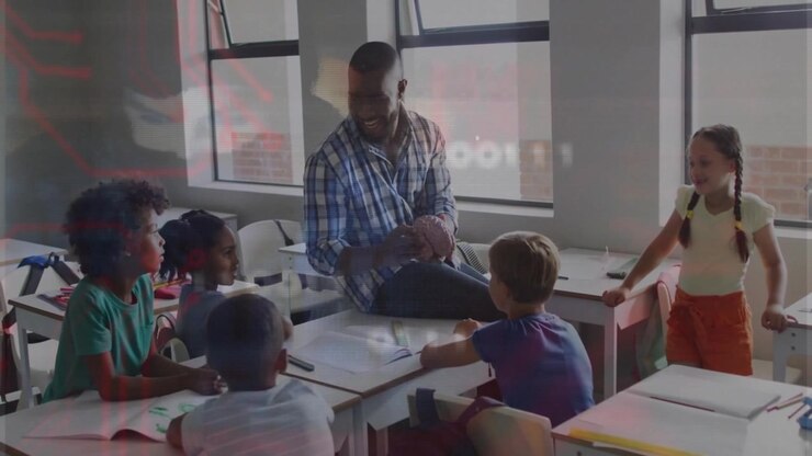 Male teacher tilting ball in bright classroom, guiding students sketching ball surface in notebooks
