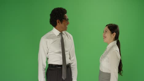 two people high 5 on green screen