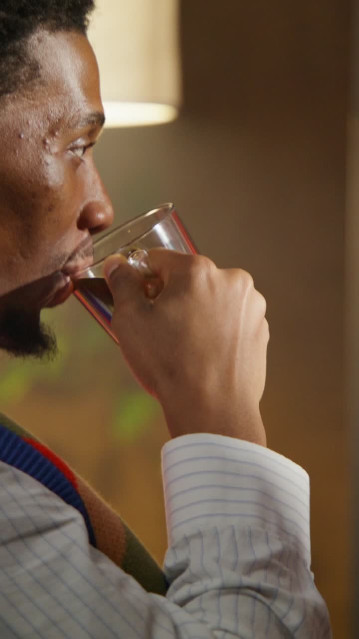 Man enjoying a drink at home
