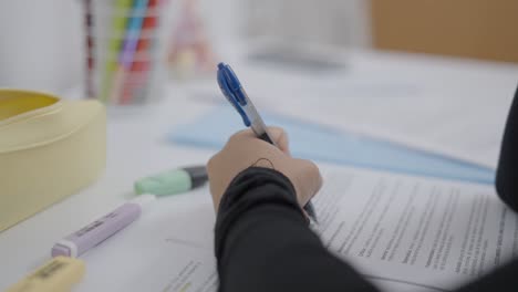 student taking notes/exam