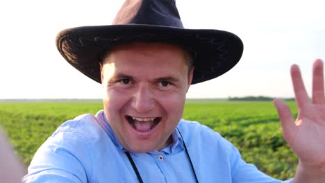 happy farmer looking at camera and smiling portrait of handsome young adult man with straw hat on happy farmer looking at camera and smiling portrait of handsome young adult man with straw hat on head modern and traditional agribusiness joyful man feeling happiness cheerful countryman