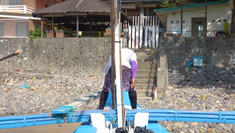 A-Fisher-Man-Standing-on-a-Docking-Boat-on-the-Harbor