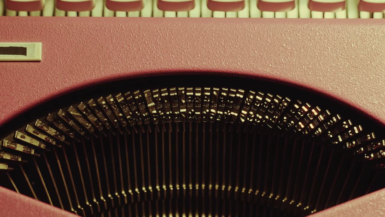 Close-Up Typebars of Retro Typewriter in Use