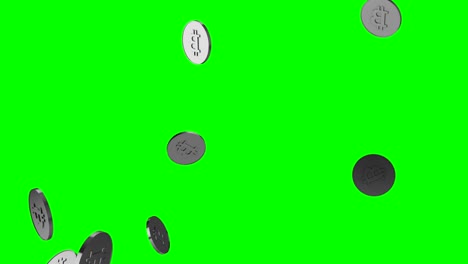 silver bitcoins falling over green background.