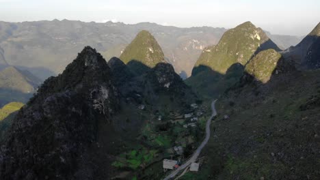 Slow-moving-Aerial-Dolly-in-at-Happiness-Road,-Ha-Giang-Loop,-Dong-Van,-Vietnam