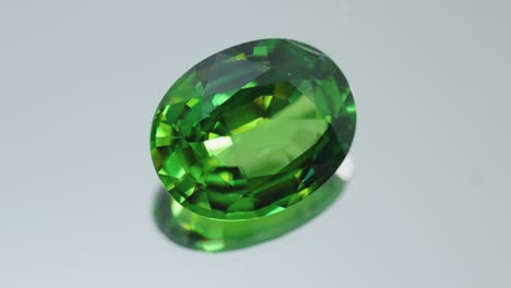 Polished-green-gemstone-rotates-and-sparkles