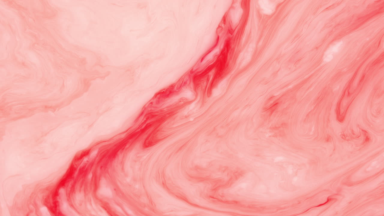 fotografía de cerca de la ebullición de un fluido rojo y blanco