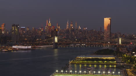stunning night view of the new york city skyline and queensboro bridge