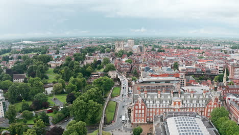 low establishing drone shot towards york minster cathedral over city wall cloudy day