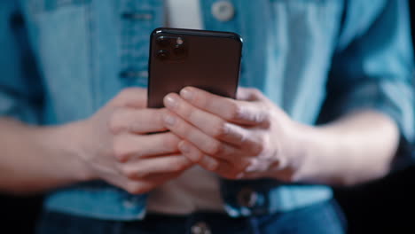 -Close-up-of-a-caucasian-woman's-hands-texting-or-using-her-cell-phone