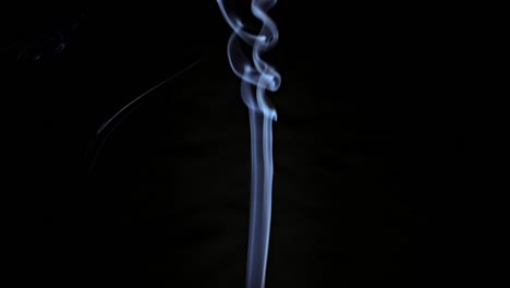 smoke from extinguished candle after meditation in studio