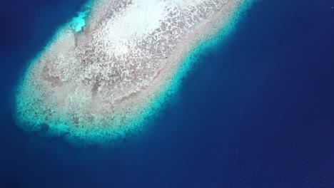 Revealing-drone-shot-of-small-island-in-the-Maldives