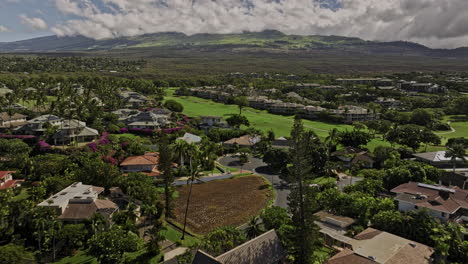 Wailea-Makena-Maui-Hawaii-Aerial-v14-flyover-residential-community-across-golf-course-capturing-hillside-neighborhood,-resort-hotels-and-Kalahaku-mountain-view---Shot-with-Mavic-3-Cine---December-2022