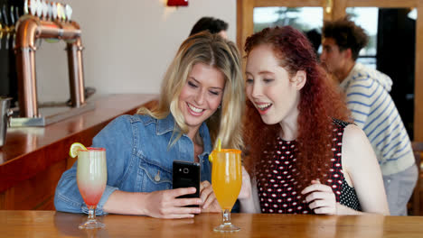 female friends taking selfie with mobile phone 4k