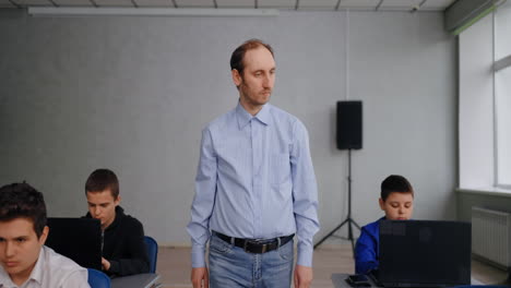 teacher in a classroom with students