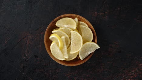sliced fresh lemon on the plate slowly rotates.