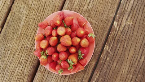 overhead of fresh strawberries in bowl