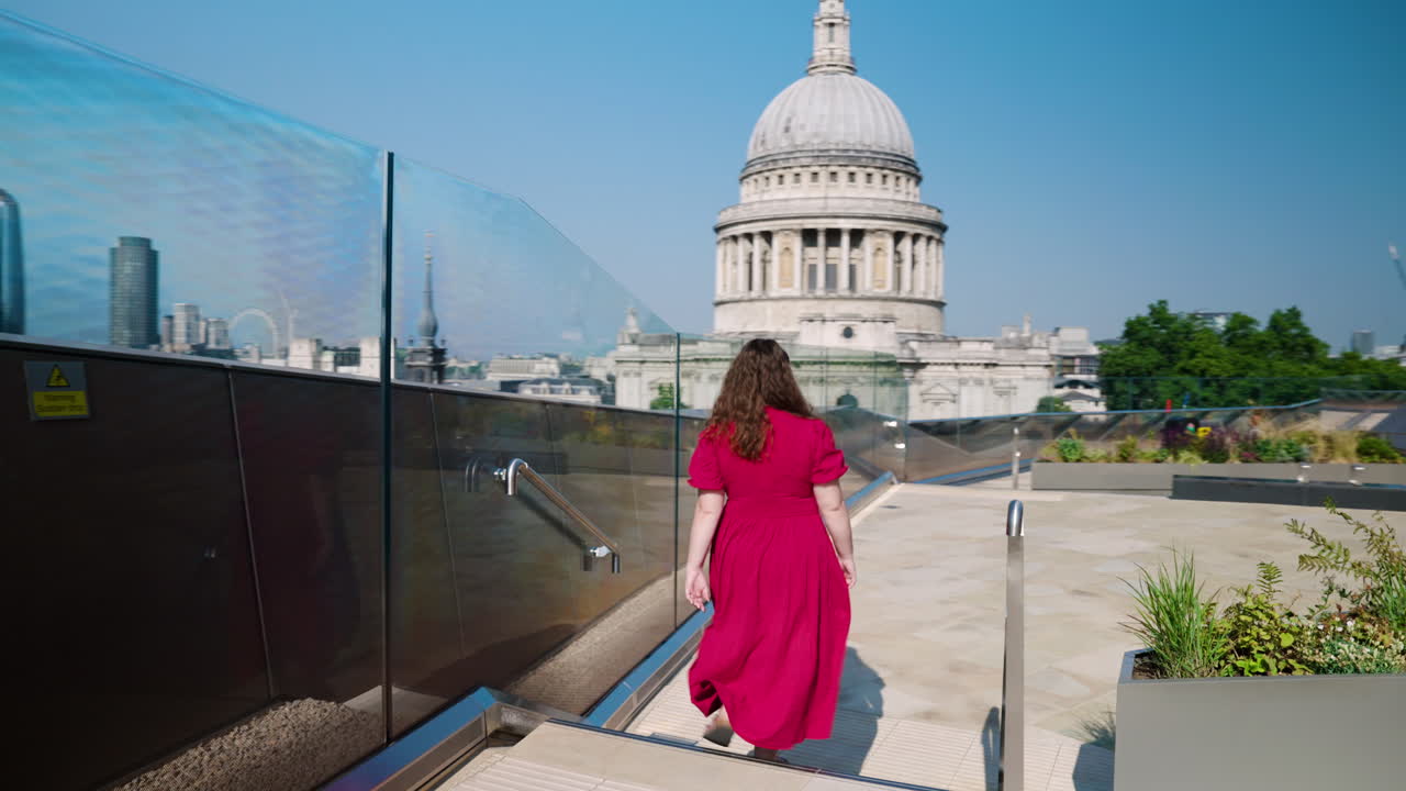 Woman Walking In The Rooftop Overlooking The St. Paul's Cathedral in London, England, UK. - follow shot