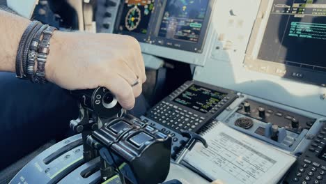 hands of a pilot on the cockpit of a commercial aircraft in flight