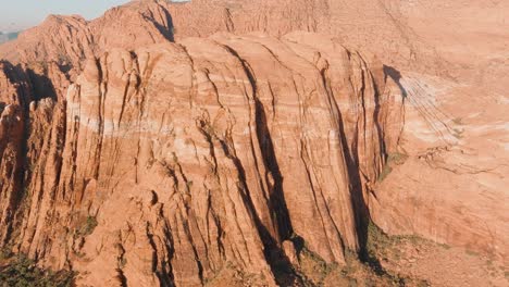 panning aerial of utah's desert mountains in the summer heat