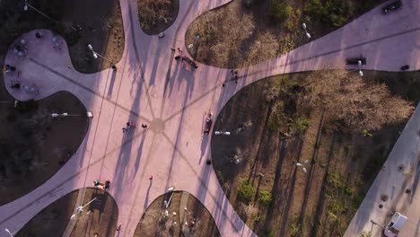 aerial top-down forward over park in palermo neighborhood at sunset, buenos aires