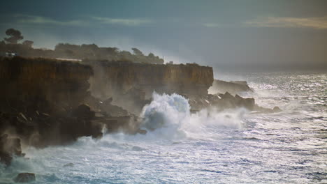 storm ocean hitting rocky coastline. powerful waves splashing making explosion