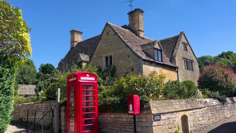 old telephone box and a letter box on the corner street at cotswold village of stanton near broadway, gloucestershire uk