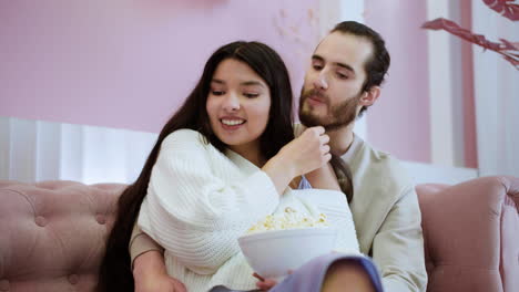 Couple-kissing-on-the-sofa