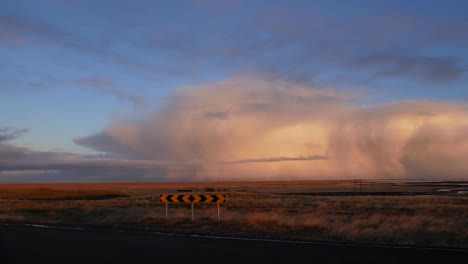 large, building cloud with an approaching storm