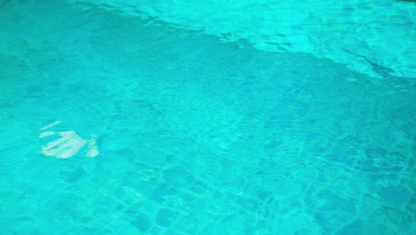 top view of the blue water texture in the swimming pool