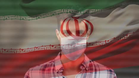 animación de la bandera de irán ondeando sobre un hombre latino con máscara facial en la calle de la ciudad
