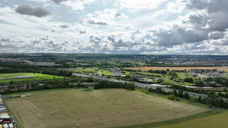 4k wide aerial push in towards the the kelpies, the largest quine sculptures in the world