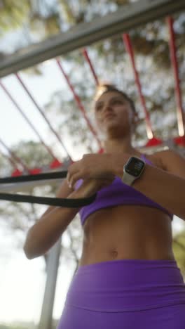 woman engaged in outdoor fitness workout in purple athletic wear