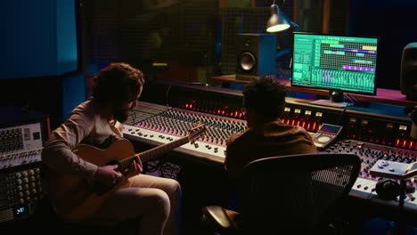 talented artist doing live performance with his guitar in professional studio