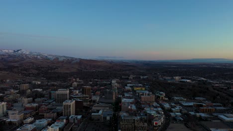 Orbiting aerial shot over Boise, Idaho during a warm sunrise