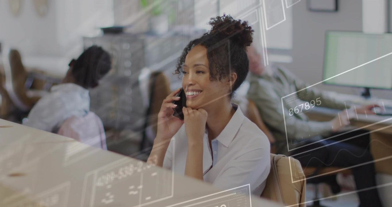 Happy Young Businesswoman Talking on Smartphone in Modern Office with Digital Data