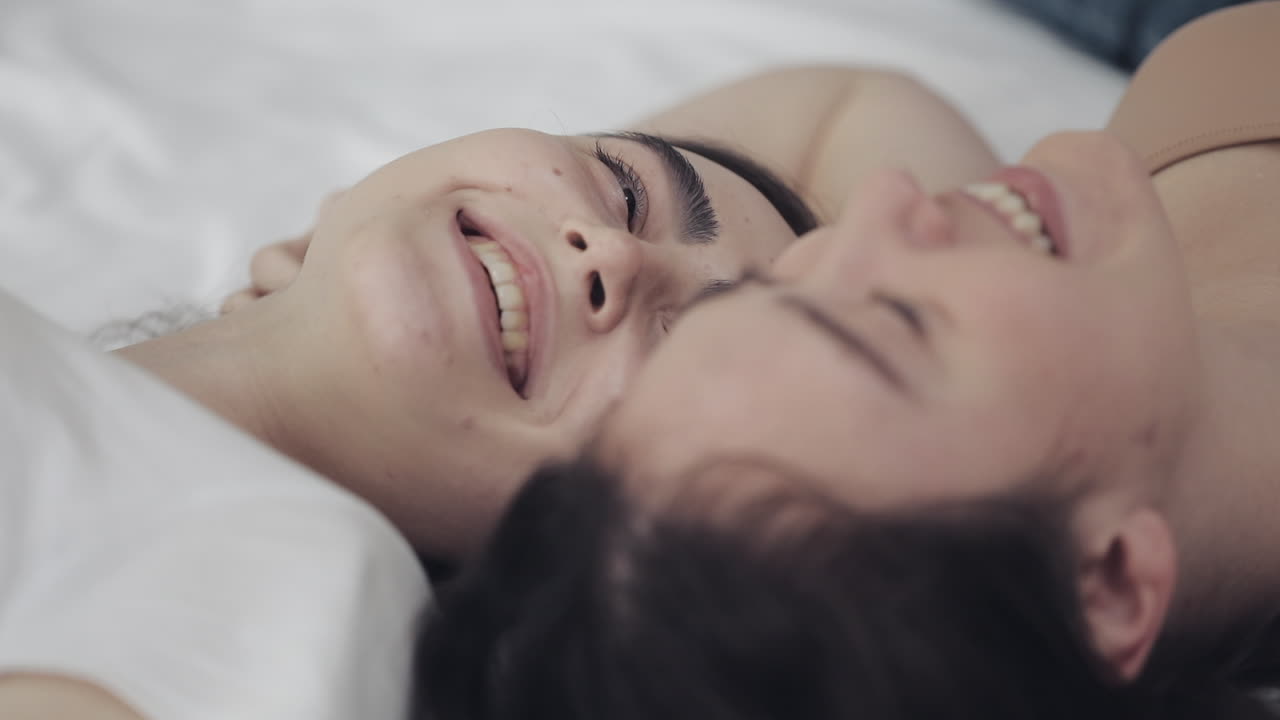 Two women in a close embrace