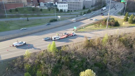 Emergency-Vehicles-Towing-Van-on-Highway-|-Aerial-Circling-View-Panning-Across-|-Summer-2022