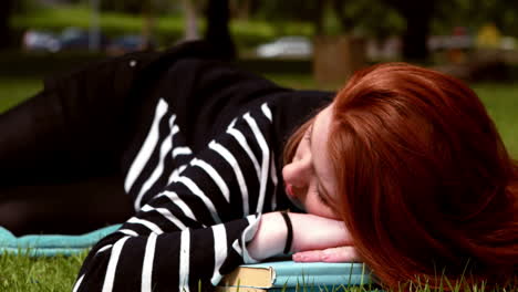 pretty student studying outside on campus