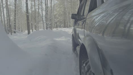 off-road truck in snowy forest